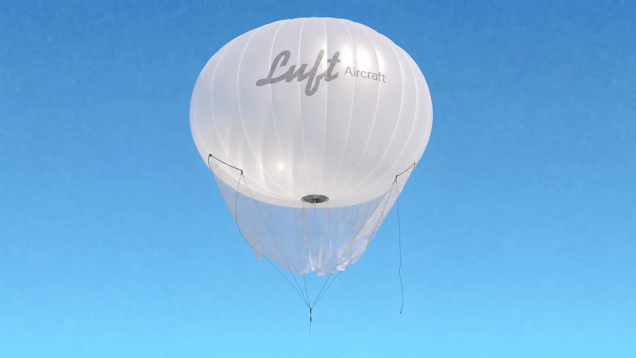 A free-flying Luft balloon rising against a clear blue sky
